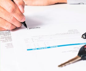 signing a contract | Doggett Lincoln of Beaumont in Beaumont TX