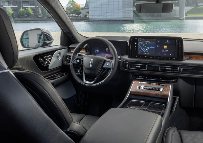 The interior of the 2025 Lincoln Aviator® SUV is shown parked with a view of a harbor through the windshield. | Doggett Lincoln of Beaumont in Beaumont TX