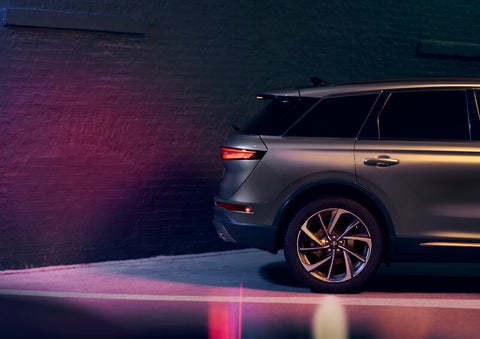 A dramatization of a 2025 Lincoln Corsair® SUV is shown backing up toward a wall. | Doggett Lincoln of Beaumont in Beaumont TX