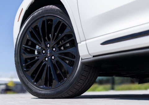 A stylish 20-inch black aluminum wheel of the available Jet Appearance Package is shown. | Doggett Lincoln of Beaumont in Beaumont TX