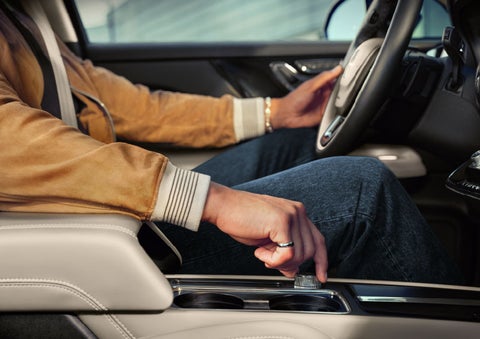 The driver of a 2024 Lincoln Corsair® SUV is shown selecting the drive mode. | Doggett Lincoln of Beaumont in Beaumont TX