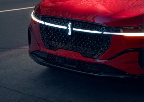 The available front LED light bar and center Lincoln Star logo glow at dusk. | Doggett Lincoln of Beaumont in Beaumont TX