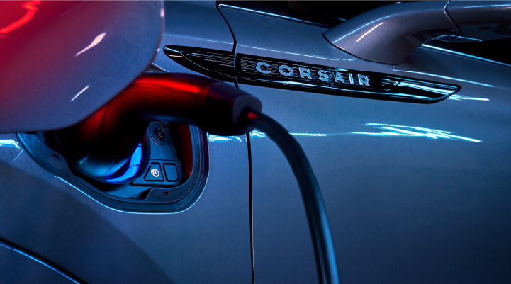 A charger plugged into the charging port of a 2025 Lincoln Corsair® Plug-in Hybrid model. | Doggett Lincoln of Beaumont in Beaumont TX