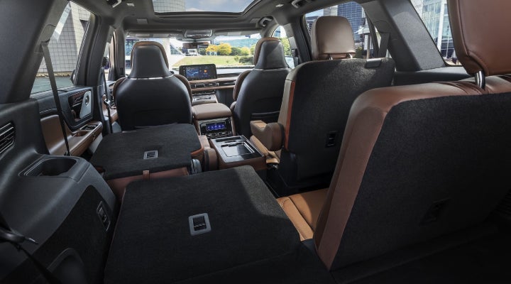 One side of the PowerFold® third-row seat and a second-row seat are folded forward in the 2026 Lincoln Aviator® SUV. | Doggett Lincoln of Beaumont in Beaumont TX