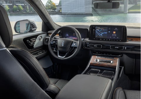 The interior of the 2026 Lincoln Aviator® SUV is shown parked with a view of a harbor through the windshield. | Doggett Lincoln of Beaumont in Beaumont TX